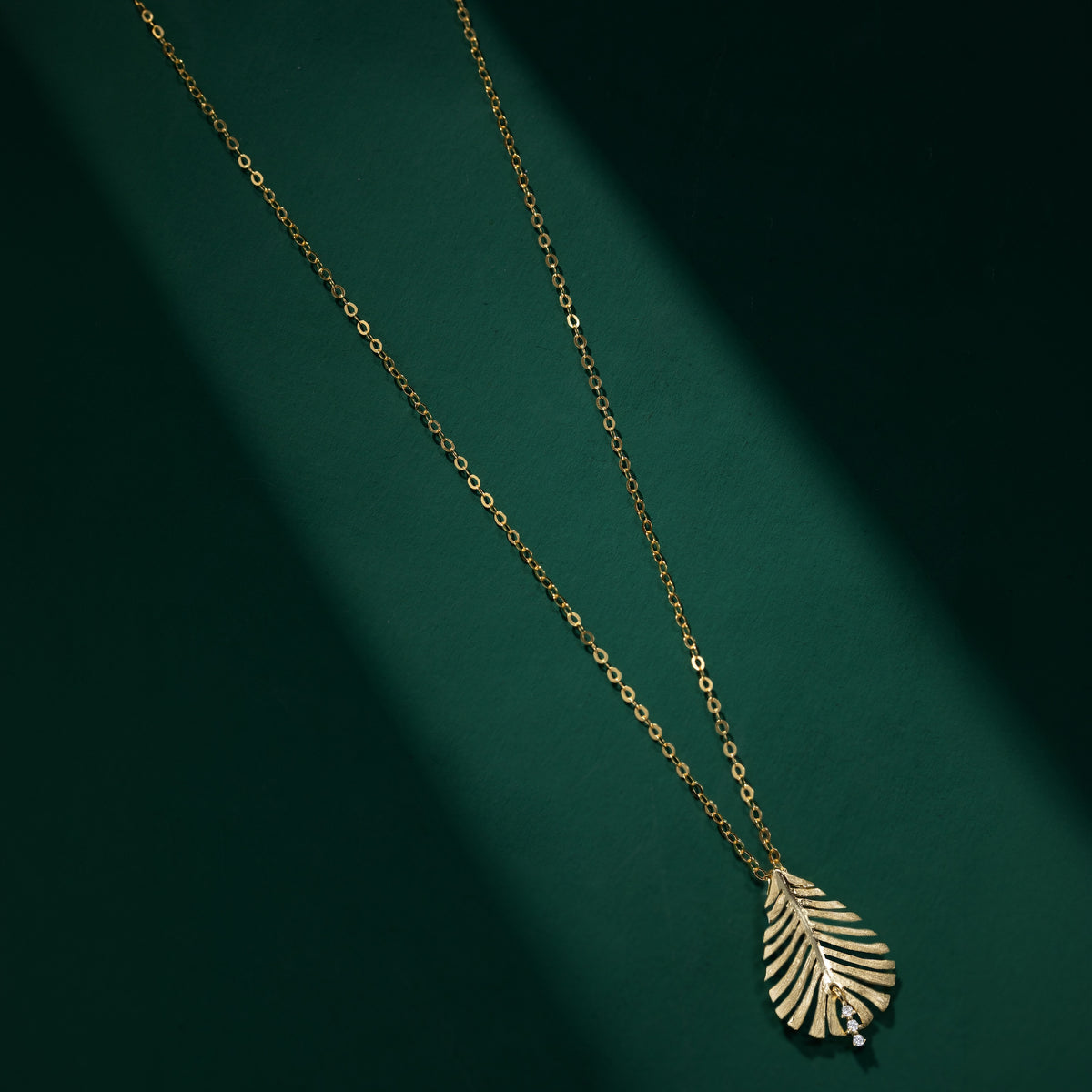 Featherstone - Brushed Gold Feather-design Moissanite necklace